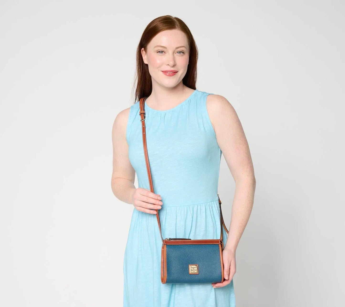 Pebble Leather East/West Crossbody Bag with Sleek Silhouette and Zipper Closure