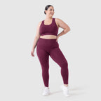Woman wearing Sculpt 3D™ anti-cellulite leggings in plum, front view, high-waisted fit