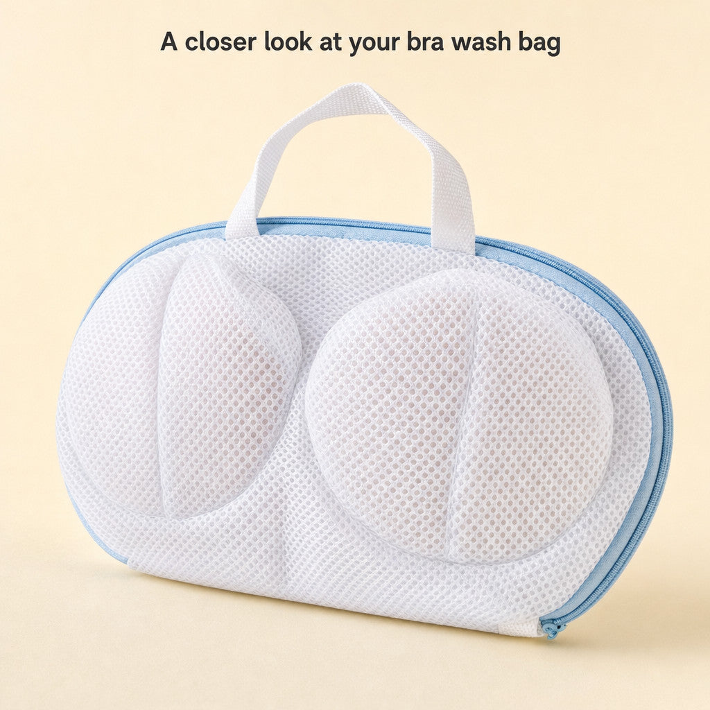 Close-up of the original bra wash bag showing white mesh, pale-blue perimeter zipper and white fabric handle.