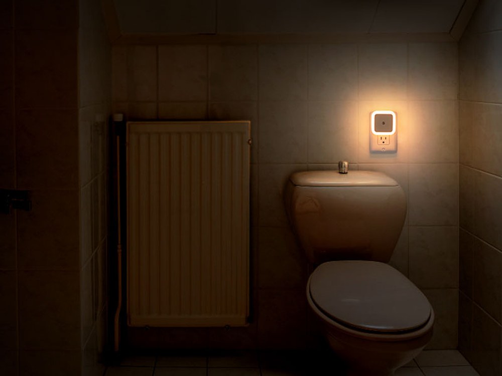Warm white square night light used in a bathroom