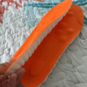 Orange cloud cushion insole showing the fabric top and foam sidewall