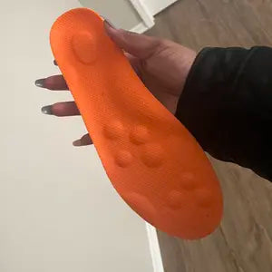 Orange top surface with molded heel area