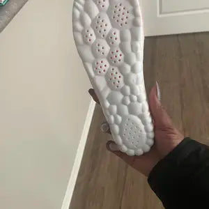 Perforated molded underside of a cloud cushion insole